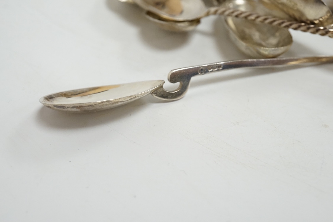 A group of assorted silver and white metal tea and coffee spoons and a pair of silver sugar tongs, weighable hallmarked silver 8.6oz.